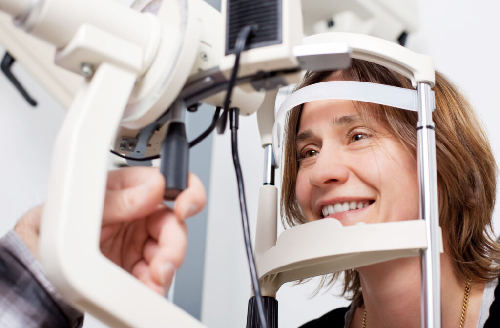 A happy-looking person undergoing an eye exam.