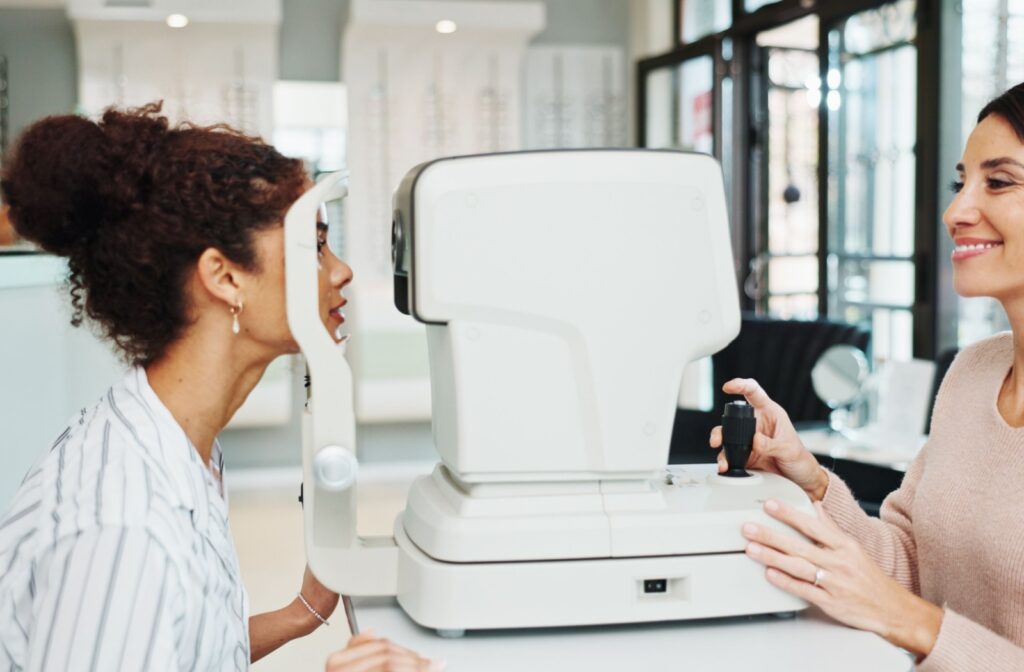 an optometrist exams a patients eyes using technology