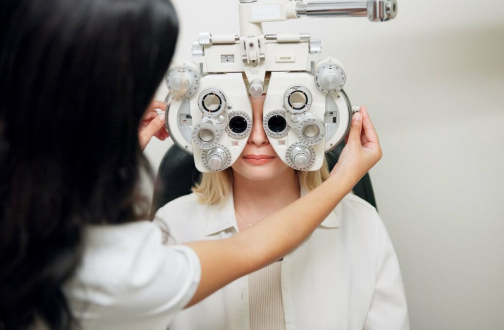 Woman sits in a chair at the optometrist and gets her prescription updated