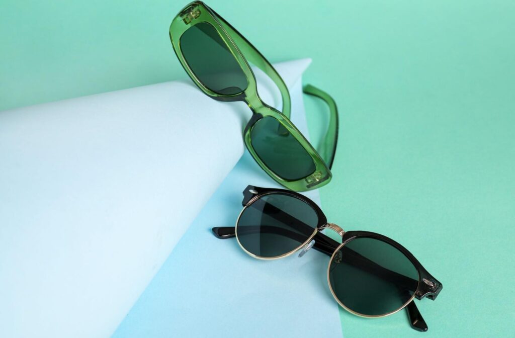 Two pairs of sunglasses with different trendy frames